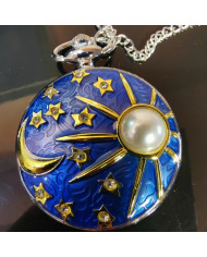Pocket watch oon a chain relief moon sunshine