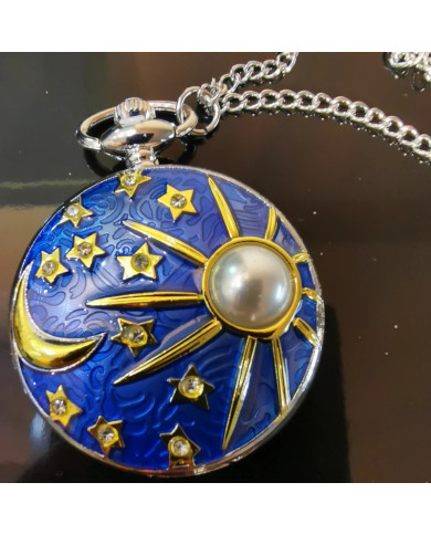 Pocket watch oon a chain relief moon sunshine